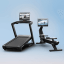 The Commercial 2450 Treadmill sitting side by side the RW900 Rower on a blue backdrop, featuring winter workouts on their touchscreens.